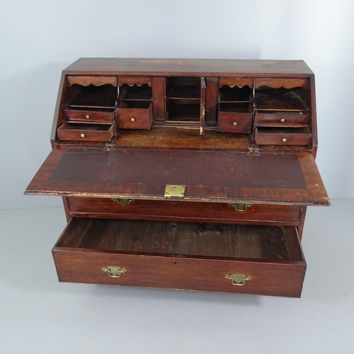 2041 - A Georgian mahogany two-section bureau, the fall front revealing a fitted interior with three long d... 