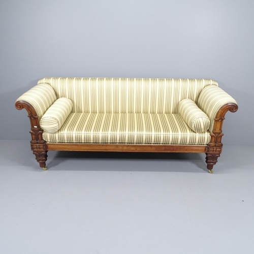 2046 - A Regency mahogany-framed and silk upholstered sofa, with roll-over arms and carved decoration. Over... 