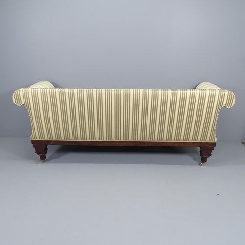 2046 - A Regency mahogany-framed and silk upholstered sofa, with roll-over arms and carved decoration. Over... 