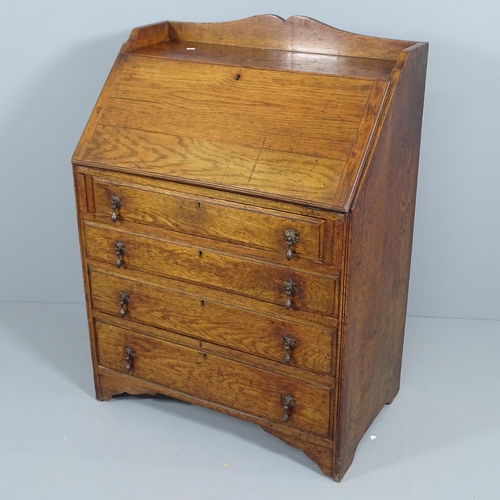 2049 - An early 20th century oak Bureau, the fall front revealing a fitted interior with three drawers belo... 