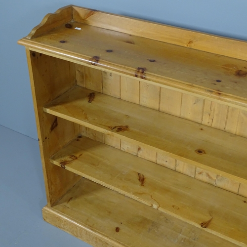 2051 - A modern pine open bookcase with two fixed shelves. 120x95x28cm