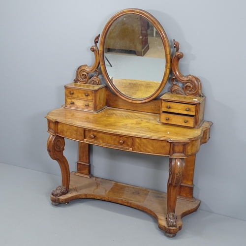 2060 - A Victorian walnut Duchess dressing table of serpentine form, with raised mirrored back. 122x150x50c... 