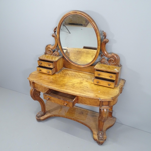 2060 - A Victorian walnut Duchess dressing table of serpentine form, with raised mirrored back. 122x150x50c... 