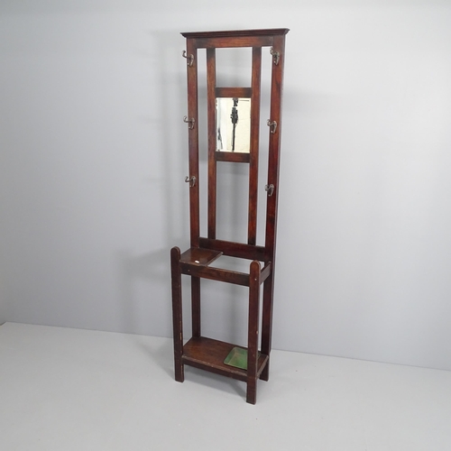 2067 - An early 20th century oak Hall stand of narrow form, with mirrored back and original drip tray. 49x1... 