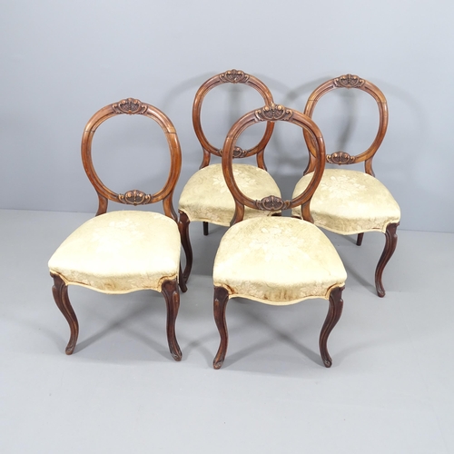 2070 - A set of four mahogany and upholstered balloon back dining chairs, with carved decoration.