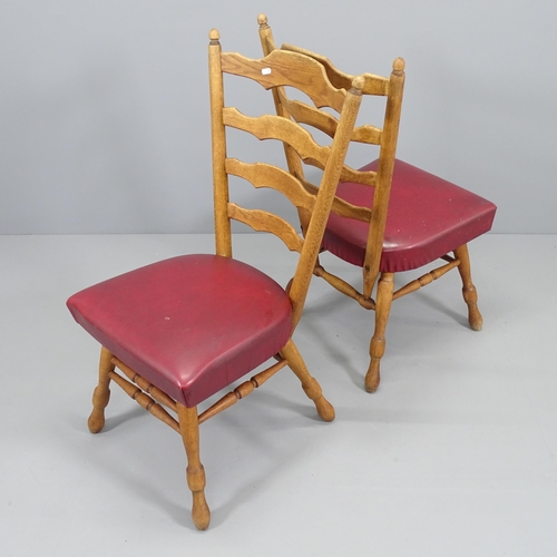 2076 - A set of four modern oak and faux-leather upholstered ladder back dining chairs.