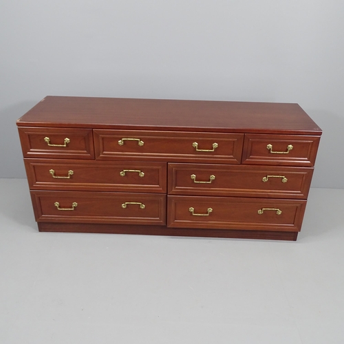 2079 - A pair of modern G plan mahogany veneered seven drawer chests. 150x70x46 each