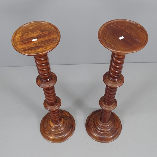 2081 - A pair of stained pine torchere stands. Height 100cm