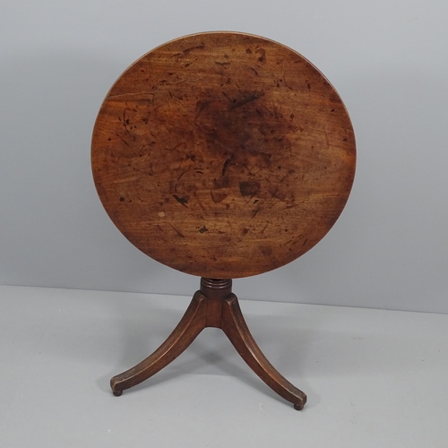 2082 - A Georgian mahogany tilt top table, raised on reeded tripod legs. W69cm H71cm