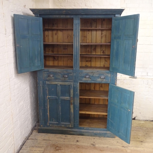 2087 - A large painted pine housemaids cupboard, fitted with four panelled doors and two drawers. 137x205x5... 