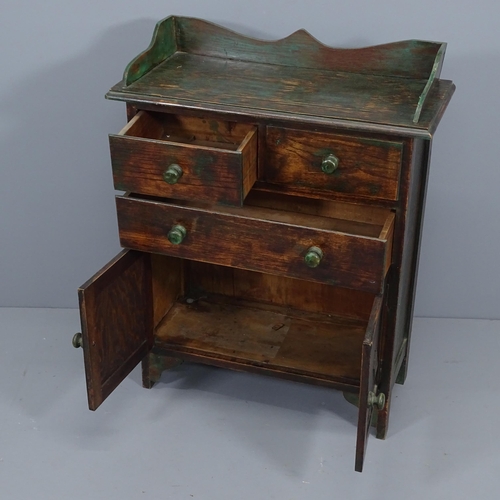 2091 - A 1920's green paint highlighted oak cabinet, with drawers and cupboards. 69x86x31cm