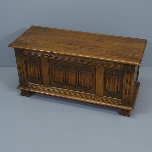 2094 - A linenfold carved and panelled oak coffer. 95x47x39cm