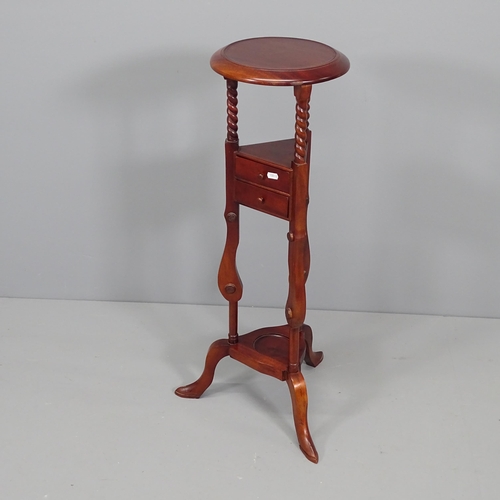 2095 - A reproduction mahogany jardiniere stand. H87cm