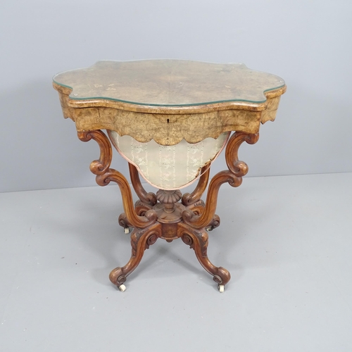 2109 - An antique walnut and burr walnut veneered workbox of shaped form, with satinwood inlay. Lifting lid... 