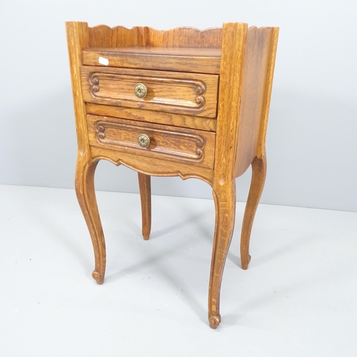 2117 - A French oak bedside cupboard with 2 drawers. 44x72x33cm.