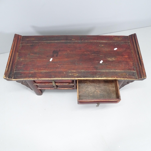 2128 - An antique Chinese elm low alter table with 2 drawers. 98x42x40cm.