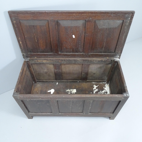 2129 - A small panelled oak blanket box. 92x50x44cm.