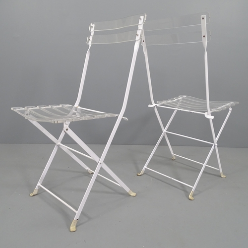 2137 - A set of 4 Lucite and white enamelled steel folding chairs.