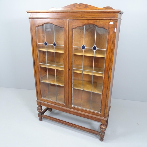 2139 - An Arts & Crafts style display cabinet with leadlight glazed doors and 3 adjustable shelves. 92x143x... 