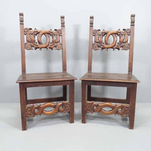 2149 - A pair of 19th century Italian Renaissance Revival oak hall chairs with auricular carved back and st... 