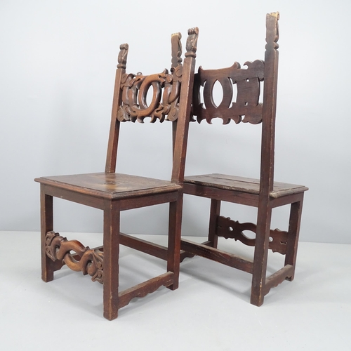 2149 - A pair of 19th century Italian Renaissance Revival oak hall chairs with auricular carved back and st... 