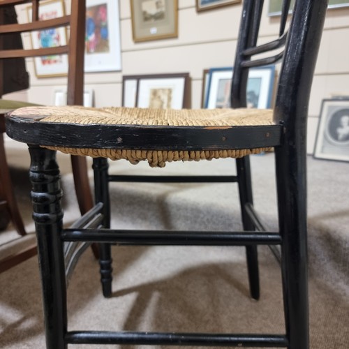 224 - A Morris & Company Arts and Crafts chair by Ford Maddox Brown, ebonised frame with rush seat, height... 