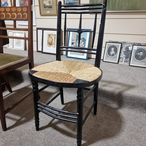 224 - A Morris & Company Arts and Crafts chair by Ford Maddox Brown, ebonised frame with rush seat, height... 