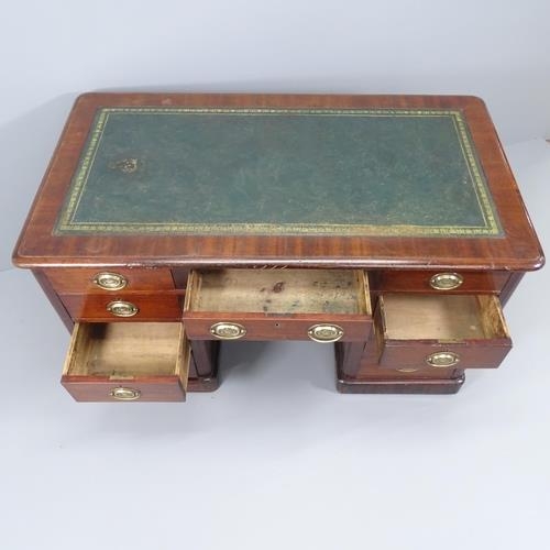 2086 - A Victorian mahogany kneehole writing desk, with ten brass Battle of Trafalgar memorial handles insc... 