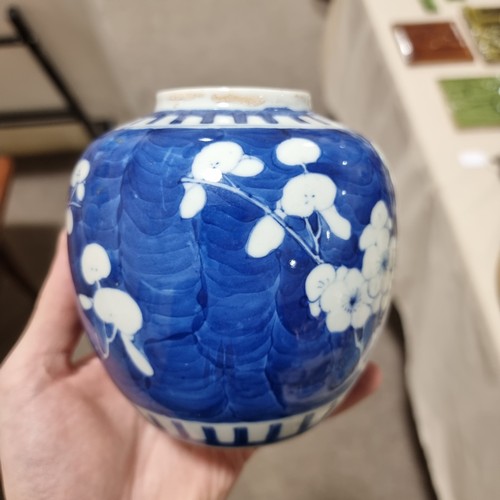 121 - A pair of blue and white prunus jars, with 4 character marks to base, and an Imari vase, tallest 18.... 