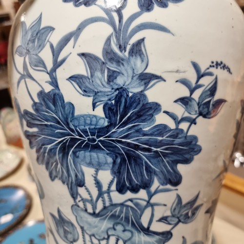 105 - A large Chinese blue and white porcelain jar with floral decoration, height 44cm