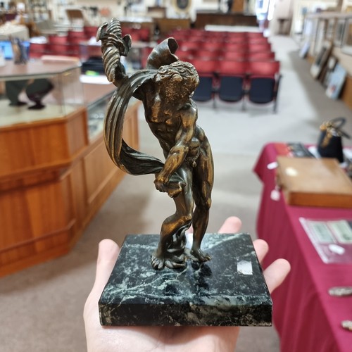 51 - An early 20th century patinated bronze Classical Zeus sculpture, unsigned, on green veined marble ba... 