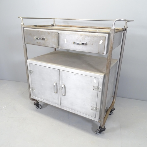 2510 - A vintage industrial aluminium medical trolley, with two drawers and cupboards under. 86x92x50cm