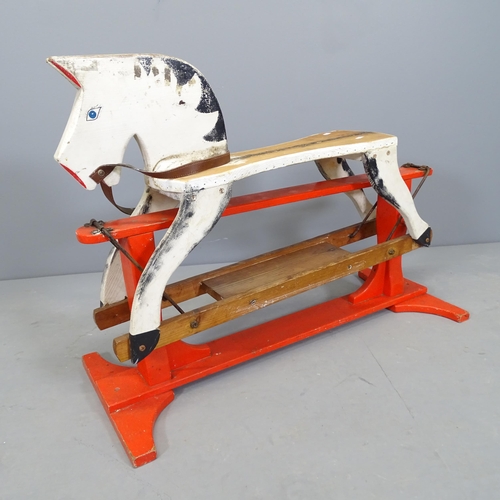 2519 - A hand made painted pine rocking horse. Length 90cm.