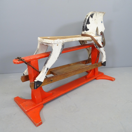 2519 - A hand made painted pine rocking horse. Length 90cm.