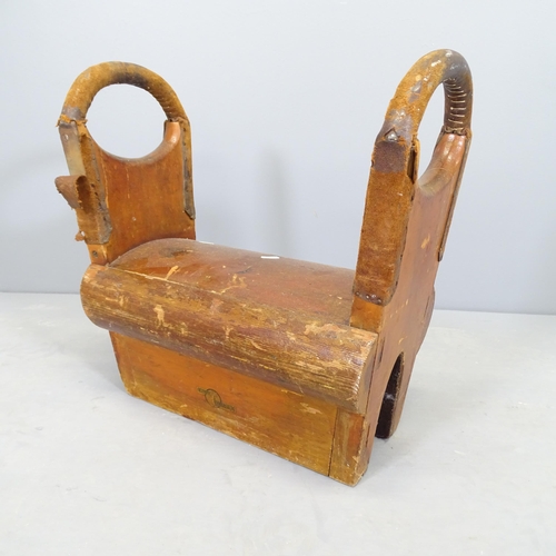 2521 - A vintage oak pommel horse, with label for Olympic Gymnasium. 48x49x25cm