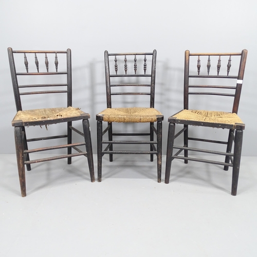 2108 - A pair of antique elm Morris style spindle back chairs with rush seats and ebonised frames, and anot... 