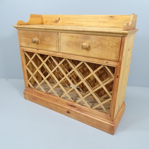 2158 - A pine side table with inbuilt wine rack and 2 drawers. 99x86x35cm.