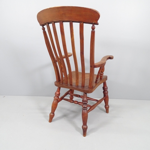 2159 - An antique elm-seated Windsor kitchen armchair.