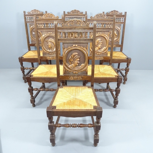 2161 - A set of 6 French oak Breton chairs, with carved back panels and rush seats.