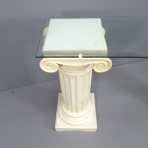 2162 - A glass top console table with 2 composite columns. Overall: 130x84x35, columns each: 35x82cm.