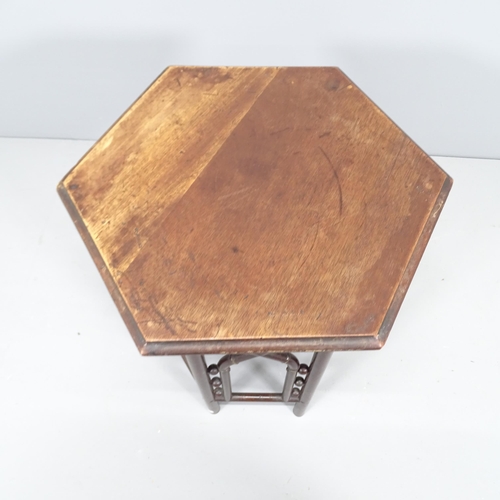 2163 - A late 19th century Anglo Moorish hexagonal side table in the manner of Liberty & Co. 46x54cm.