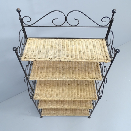 2171 - An ornate wrought iron folding stand with 5 fixed wicker shelves. 63x122x33cm.