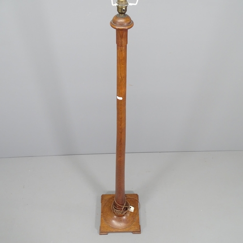 2181 - A turned stained pine standard lamp on pedestal base. Height 160cm