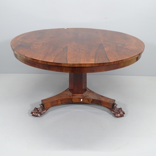 2186 - A 19th century rosewood circular tilt-top breakfast table raised on hexagonal column, platform base ... 