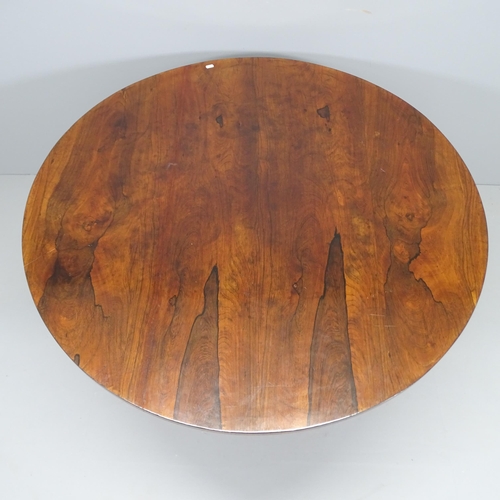 2186 - A 19th century rosewood circular tilt-top breakfast table raised on hexagonal column, platform base ... 