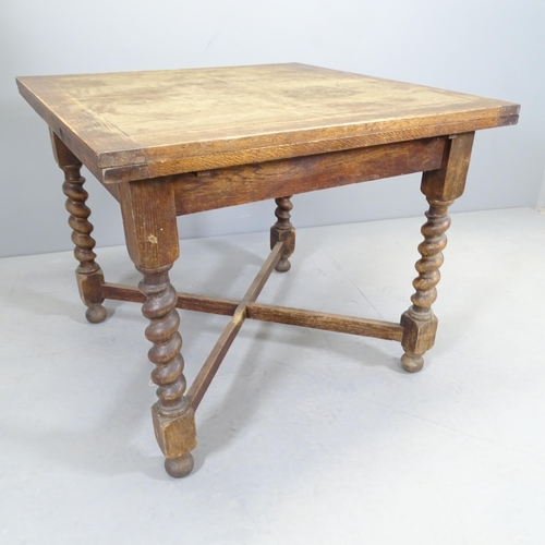 2531 - A 1920s oak draw-leaf table. 90 (extending to 148cm)x76x88cm