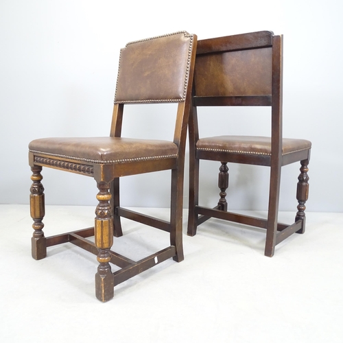 2536 - A pair of carved oak and leather upholstered hall chairs.