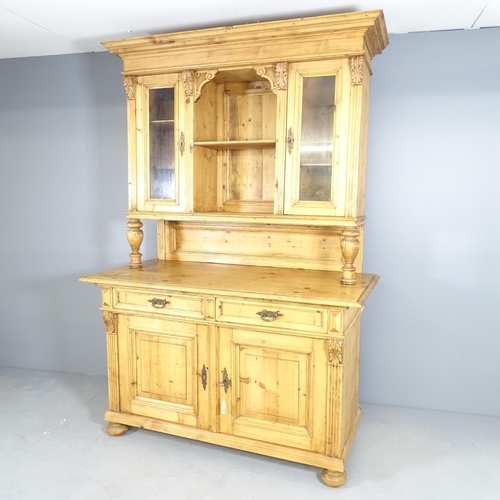 2537 - A Victorian pine two section dresser, the top section having two glazed doors and turned supports, t... 