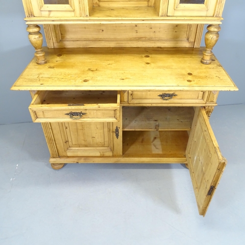 2537 - A Victorian pine two section dresser, the top section having two glazed doors and turned supports, t... 