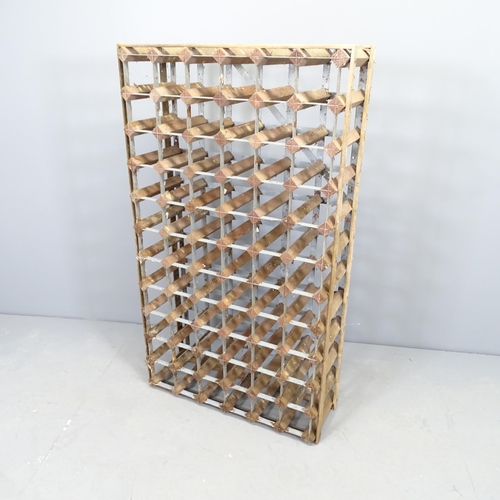 2544 - A 66 bottle wine rack. 65x112x25cm